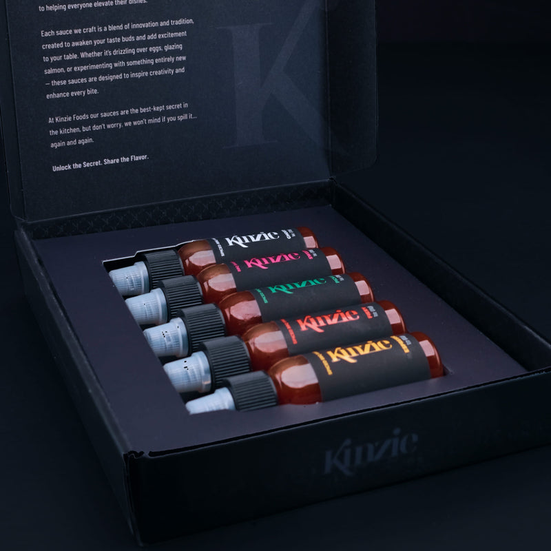 5 pack mini BBQ gift set featuring five 1 oz bottles of sauces in a black box with Kinzie branding.