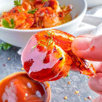 5 pack mini BBQ gift set with shrimp coated in sauce, garnished with herbs, and a bowl of dipping sauce.