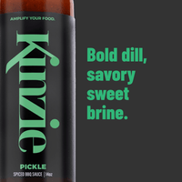 Kinnie pickle spiced BBQ sauce bottle with green text on a dark background