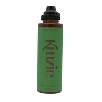 Green bottle of Kinzie Dubai Chocolate BBQ Sauce on a white background